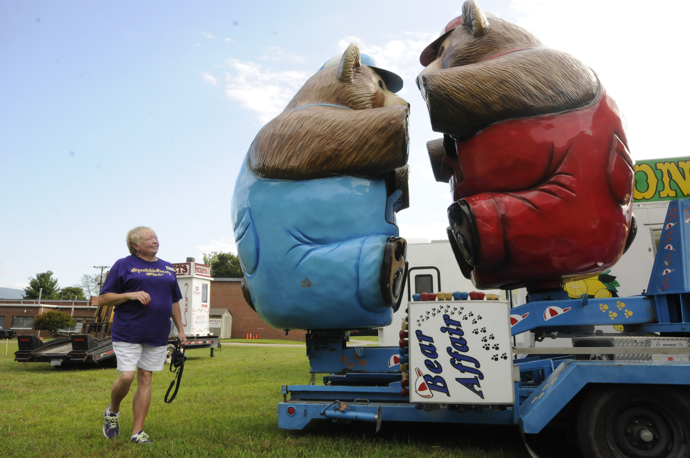 Karen Marshall, president of the 88th Annual Sequatchie County Fair, takes close look at one of the many amusement rides.