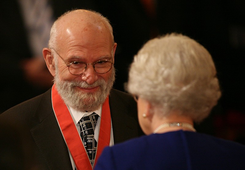 
              FILE - This is a  Nov. 26, 2008 file photo of  Dr Oliver Sacks, receiving his Commander of the Order of the British Empire (CBE ), by  Britain's Queen Elizabeth II at Buckingham Palace, London. Dr. Oliver Sacks, whose books like "The Man Who Mistook His Wife For a Hat" probed distant ranges of human experience by compassionately portraying people with severe and sometimes bizarre neurological conditions, has died. He was 82 .Sacks died Sunday at his home in New York City, his assistant, Kate Edgar, said. (Lewis Whyld/PA via AP) UNITED KINGDOM OUT  
            
