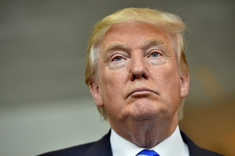 
              In this Thursday, Aug.  27, 2015, photo, Republican presidential candidate Donald Trump listens during a news conference after speaking at the TD Convention Center, in Greenville, S.C. Trump's call for mass deportation of millions of immigrants living in the U.S. illegally, as well as their American-born children, bears similarities to a large-scale removal that actually happened to many Mexican-American families 85 years ago.  (AP Photo/Richard Shiro)
            