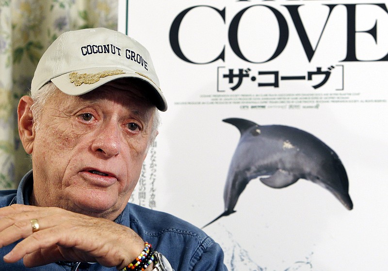 
              FILE - In this June 15, 2010 file photo, Ric O'Barry, whose efforts to save dolphins is documented in the Oscar-winning film "The Cove," speaks during an interview in Tokyo. Anti-dolphin-hunt campaigner Ric O’Barry is in detention in western Japan after being arrested for not carrying his passport. His son and fellow activist Lincoln O’Barry said the 75-year-old American was stopped while driving home from dinner at a restaurant Monday night, Aug. 31, 2015. (AP Photo/Koji Sasahara, File)
            