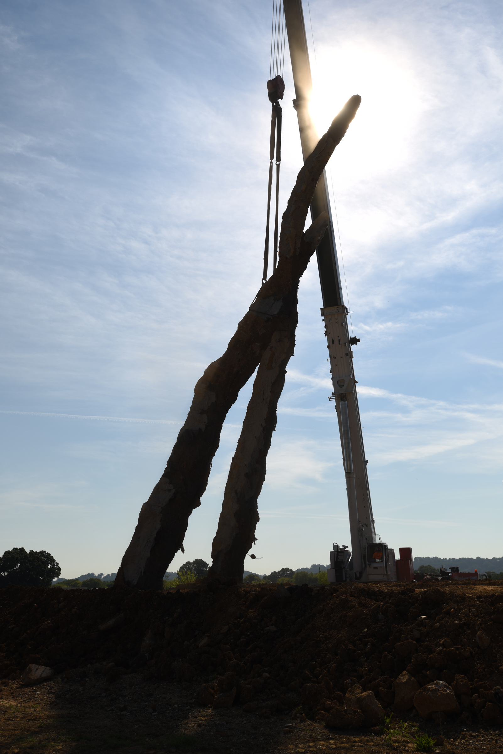 A crane raises a 65-foot-tall sculpture Tuesday, September 1, 2015, at the Sculpture Fields at Montague Park as a tribute to honor the five military members who were slain in July. Artist Peter Lundberg created the sculpture, named Anchors.