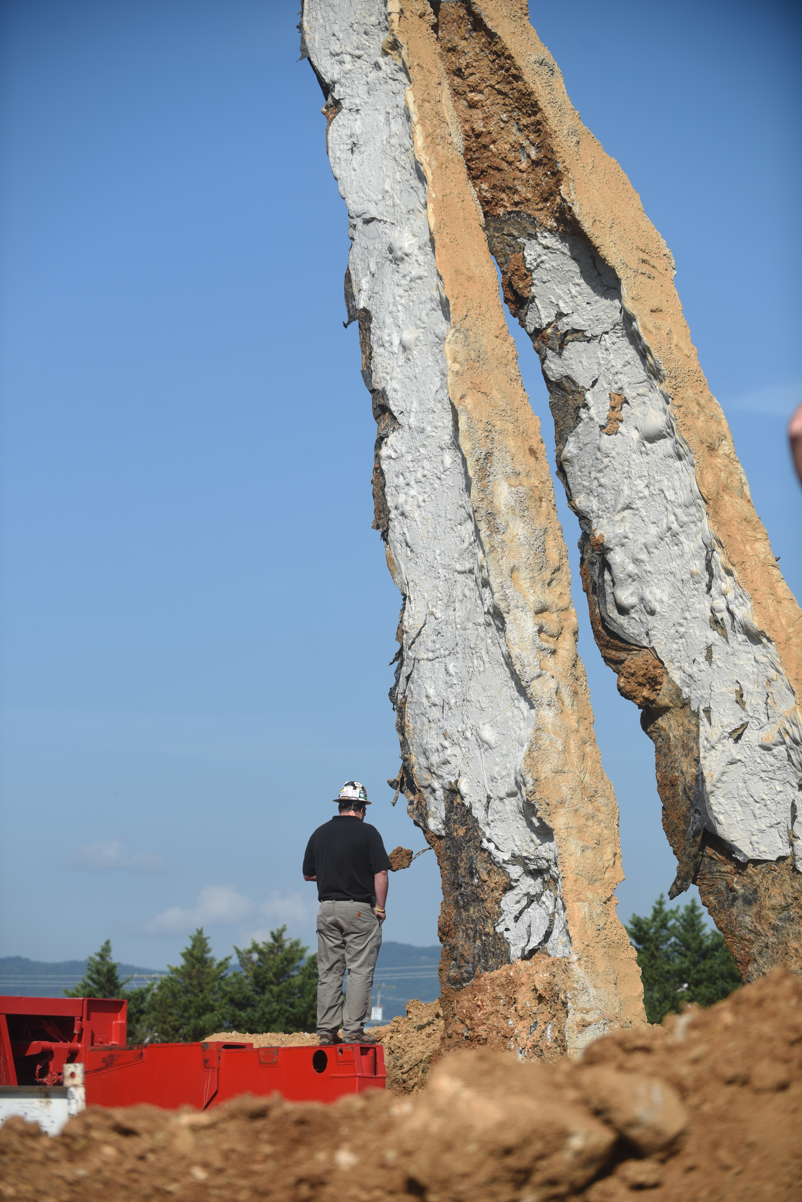 A crane raises a 65-foot-tall sculpture Tuesday, September 1, 2015, at the Sculpture Fields at Montague Park as a tribute to honor the five military members who were slain in July. Artist Peter Lundberg created the sculpture, named Anchors.