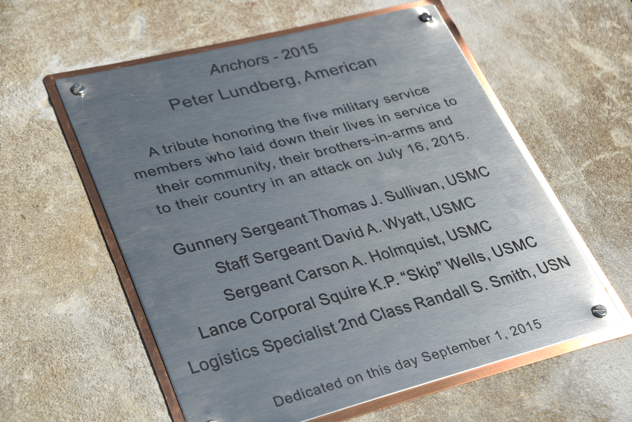 A plaque tells information about a 65-foot-all sculpture Tuesday, September 1, 2015, at the Sculpture Fields at Montague Park. The sculpture, created by artist Peter Lundberg is a tribute to honor the five military members who were slain in July.