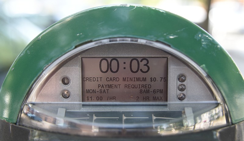 A meter shows rates and hours Tuesday, September 1, 2015. Parking rates have been raised and the hours of collection extended.