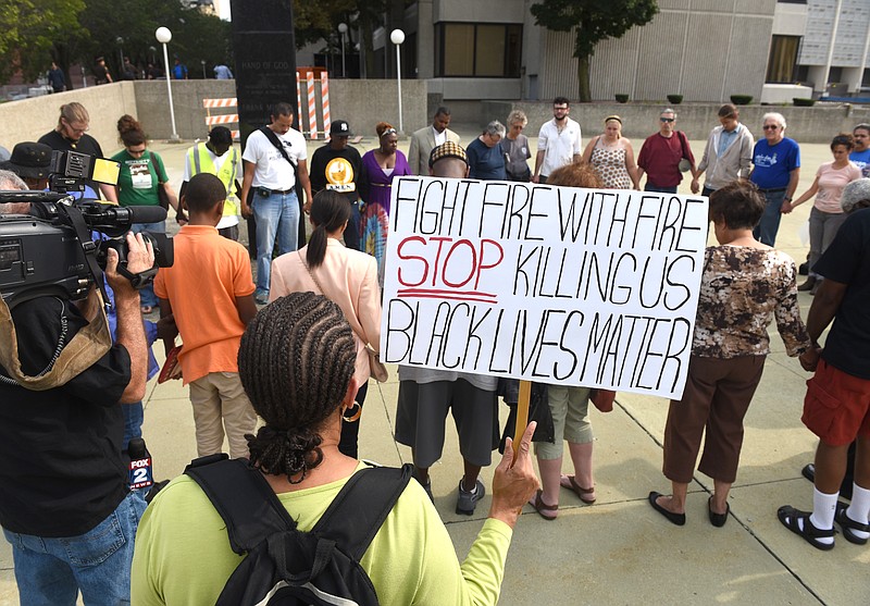 
              In this Friday, Aug. 28, 2015 photo, dozens of people gather during a rally outside the Frank Murphy Hall of Justice in Detroit regarding the shooting death of Terrance Kellom by an U.S. Immigration and Customs Enforcement (ICE) officer in April 2015. As the Black Lives Matter movement gains more public attention, there are questions being raised about who’s in charge of the movement and what its long-term goals are. (Max Ortiz/The Detroit News via AP)
            