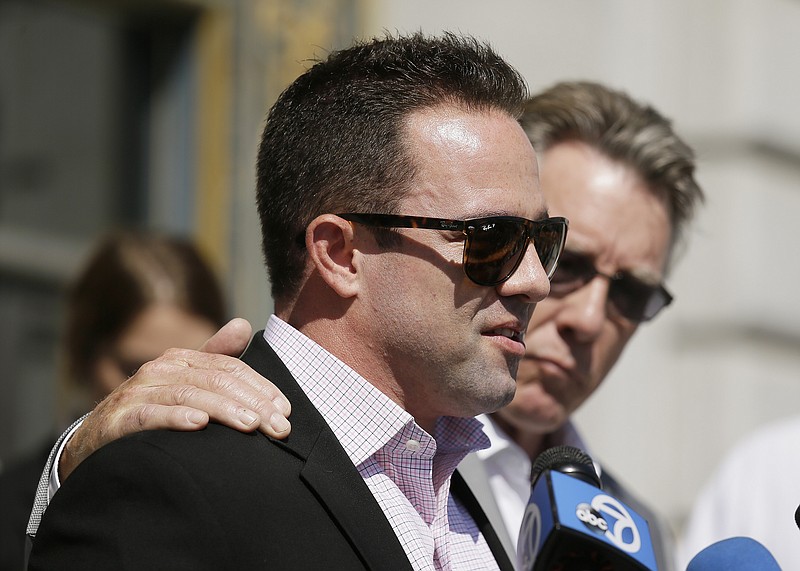 
              Brad Steinle, left, and Jim Steinle, right, the brother and father of Kathryn Steinle, answer questions during a news conference on the steps of City Hall Tuesday, Sept. 1, 2015, in San Francisco. The parents of the San Francisco woman shot to death by a man being sought for deportation filed legal claims against San Francisco and federal officials in connection with her killing. Kathryn Steinle was shot to death on Pier 14 on July 1 as she walked with her father. (AP Photo/Eric Risberg)
            