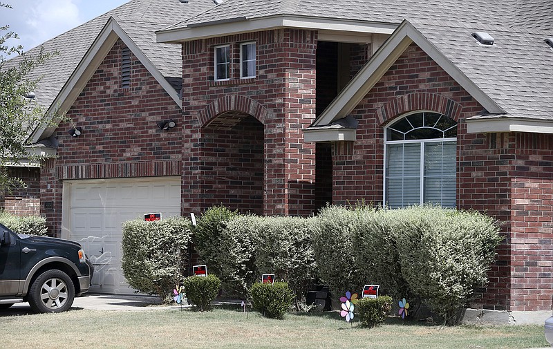
              No trespassing signs are visible at the house Tuesday, Sept. 1, 2015, where deputies fatally shot Gilbert Flores, in Northwest Bexar County, Texas, near San Antonio, last Friday. A Texas prosecutor says a second video has emerged that gives authorities a “very clear view” of a confrontation between deputies and Flores who had his hands raised before he was shot and killed. (John Davenport/The San Antonio Express-News via AP) RUMBO DE SAN ANTONIO OUT; NO SALES; MANDATORY CREDIT
            