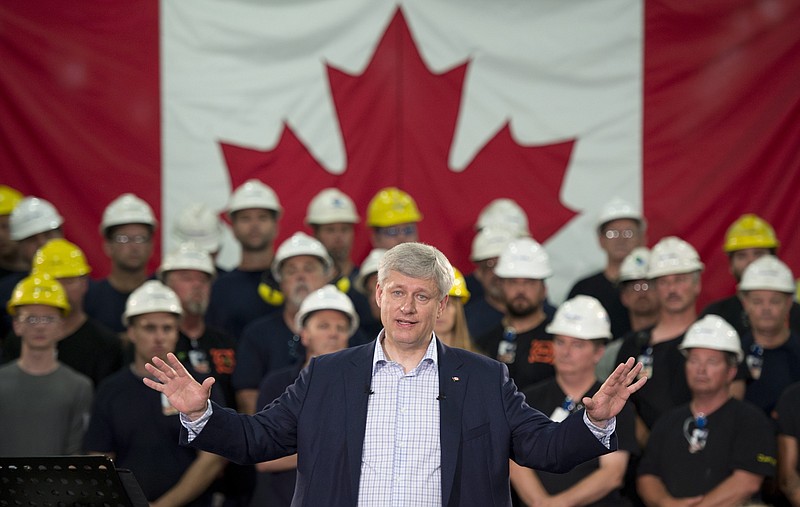
              Prime Minister Stephen Harper speaks during a campaign stop at a steel manufacturer in Burlington, Ontario, Canada on Tuesday, Sept. 1, 2015.   (Adrian Wyld/The Canadian Press via AP)  MANDATORY CREDIT
            