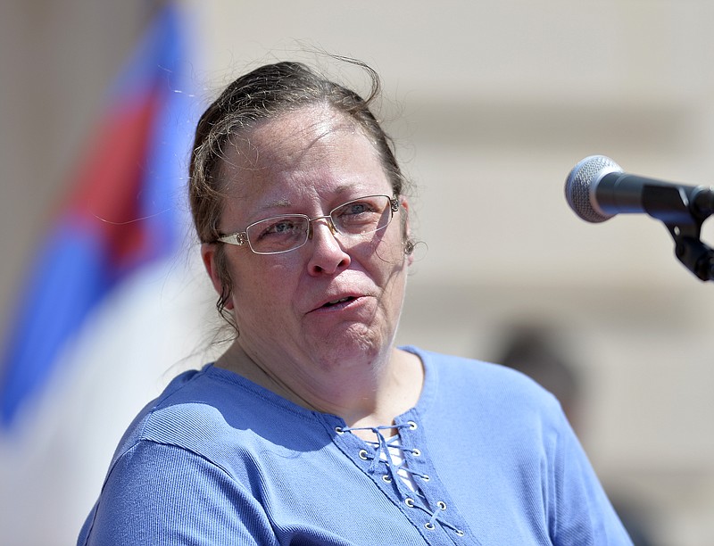 
              Rowan County, Ky. Clerk Kim Davis shows emotion as she is cheered by a gathering of supporters during a rally on the steps of the Kentucky State Capitol in Frankfort Ky. The U.S. Supreme Court on Monday, Aug. 31, 2015, ruled against Davis, who has refused to issue same-sex marriage licenses. (AP Photo/Timothy D. Easley, File)
            