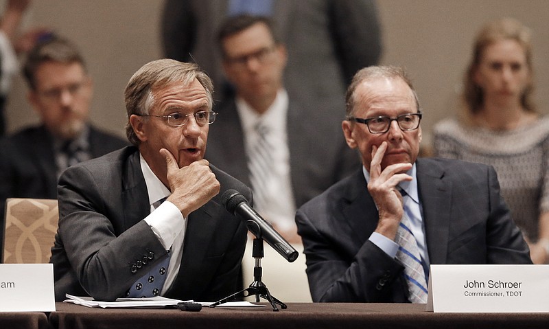 Gov. Bill Haslam, left, and John Schroer, right, commissioner of transportation, listen to a discussion during a meeting of Haslam's 15-stop transportation funding tour Thursday, Aug. 13, 2015, in Nashville.