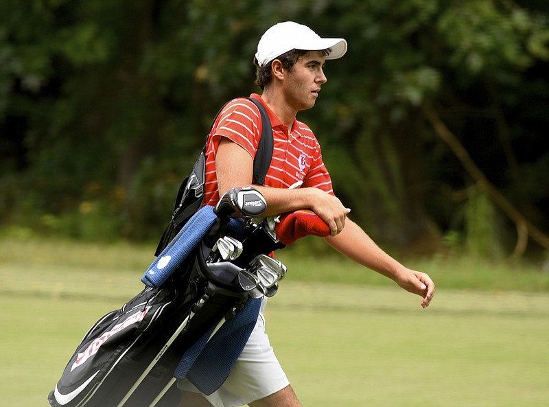 Oliver Simonsen (CQ) carries his bag on the fairway at the City Prep Championship, a one-day golf tournament at the Bear Trace Harrison Bay course on Wednesday, Sept. 2, 2015, in Harrison, Tenn. 