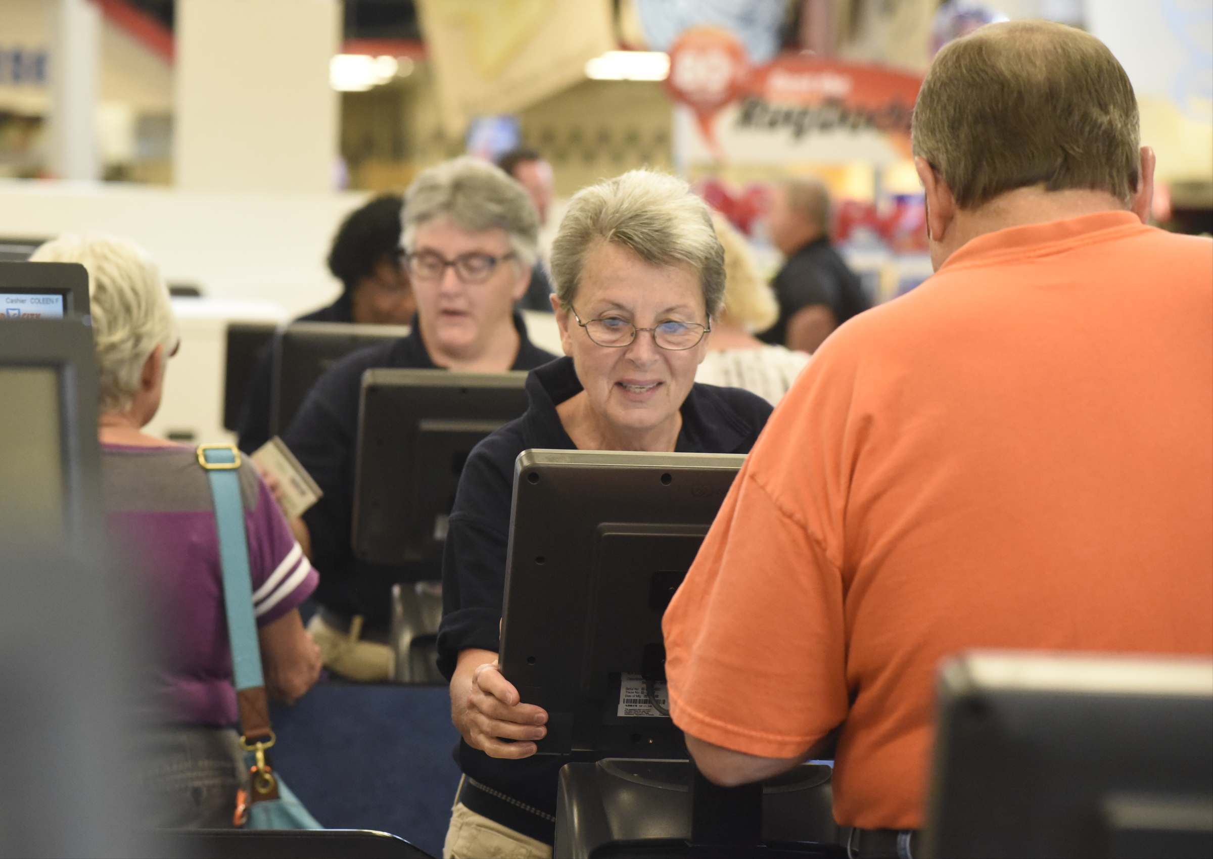Cashier Colleen Frank waits on customer David R. Smith on the first day of business for the new Food City grocery store Wednesday, Sept. 2, 2015, in Red Bank, Tenn. The store, formerly a Bi-Lo at the intersection of Morrison Springs Road and Dayton Boulevard, was reopened after a three-day turnaround.