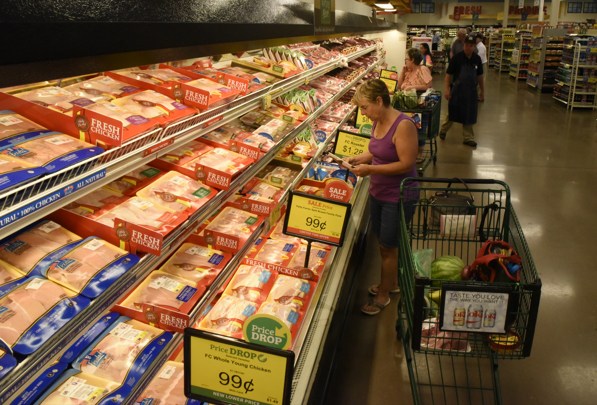 Miriam Roides (CQ), from Hixson, selects items from the meat case on the first day of business for the new Food City grocery store Wednesday, Sept. 2, 2015, in Red Bank, Tenn. The store, formerly a Bi-Lo at the intersection of Morrison Springs Road and Dayton Boulevard, was reopened after a three-day turnaround.