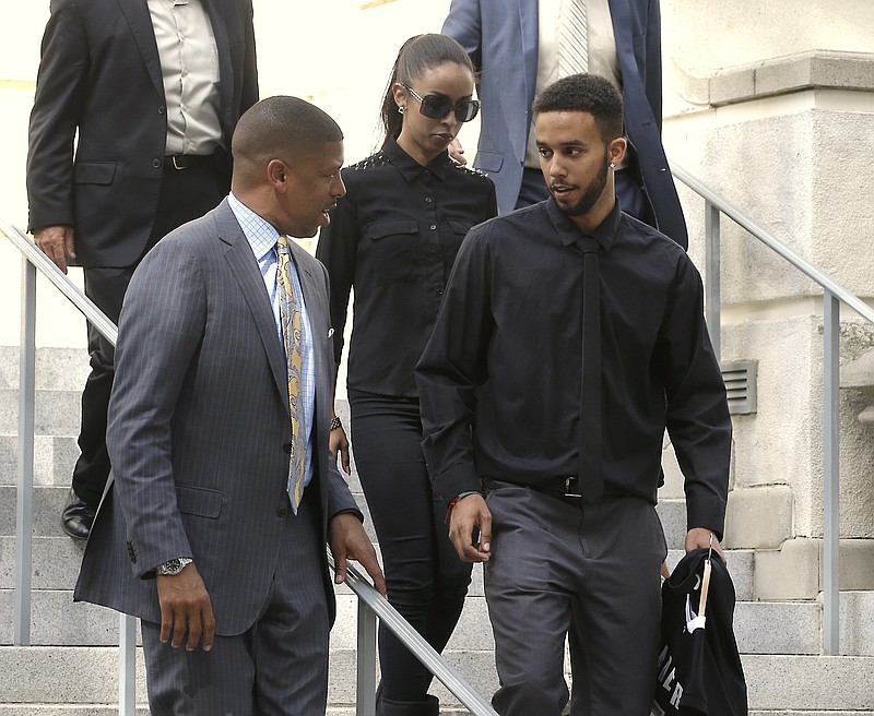 
              File-This Aug. 26, 2015, file photo shows Anthony Sadler, right, one of the three Americans that helped stop an alleged terrorist shooting aboard a Paris bound train, talking with Sacramento Mayor Kevin Johnson as they leave City Hall after a a brief news conference in Sacramento,Calif.  On "The Tonight Show Starring Jimmy Fallon" Tuesday, Sept. 1, 2015,Sadler says he initially was asleep when Ayoub El-Khazzani was spotted with an AK-47 and other weapons on Aug. 21. Sadler says his friends, U.S. Air Force Airman Spencer Stone and Oregon National Guardsman Alek Skarlatos, charged the gunman and that he suddenly awoke and began grappling with him too. The audience began applauding when Fallon asked what happened next and Sadler replied they "beat him down a little bit." (AP Photo/Rich Pedroncelli, File)
            