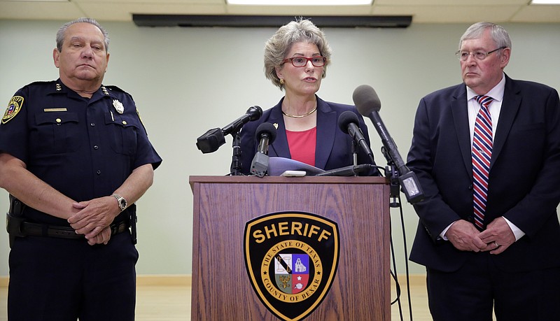 Bexar County Sheriff Susan Pamerleau, center, stands with Chief Deputy Manuel Longoria, left, and George Saidler, deputy chief of the Criminal Investigations Division for the Bexar County Sheriff's Office, during a news conference at the Bexar County Sheriff's office, Wednesday, Sept. 2, 2015, in San Antonio.