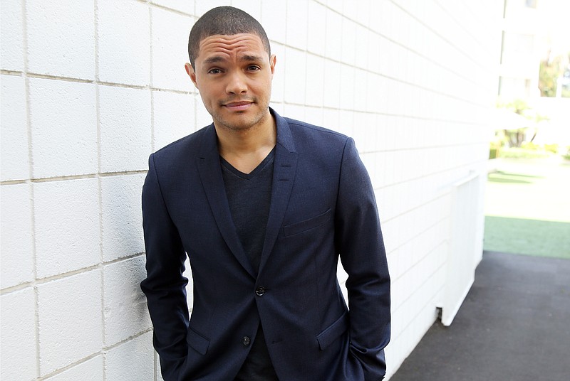 
              FILE - In this July 29, 2015 file photo, Trevor Noah, host of the new "The Daily Show with Trevor Noah," poses for a portrait in Beverly Hills, Calif.  The show has added three new comics to its rotating cast of correspondents; Ronny Chieng,  Desi Lydic, from MTV’s “Awkward” and Roy Wood Jr., a stand-up comic who participated in NBC’s “Last Comic Standing” and Comedy Central’s “Laugh Riots.”   (Photo by Matt Sayles/Invision/AP, File)
            