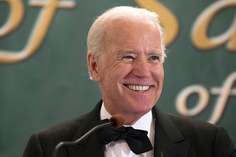 
              File- This March 17, 2015 file photo shows Vice President Joseph R. Biden, Jr. speaking during the 110th annual dinner of the Friendly Sons of Saint Patrick of Lackawanna County at Genetti Manor in Dickson City, Pa.   Biden is headed to Florida, where he’s sure to get a glimpse of his presidential prospects as he considers a late entry into the 2016 Democratic primaries. (Christopher Dolan/The Times & Tribune via AP)
            