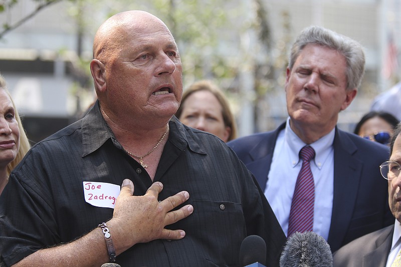 
              Detective James Zadroga's father Joe Zadroga, left, speaks during a news conference, Thursday, Sept. 3, 2015, in New York. Lawmakers called on Congress to prevent expiration of the James Zadroga Sept. 11 Health and Compensation Act(AP Photo/Mary Altaffer)
            