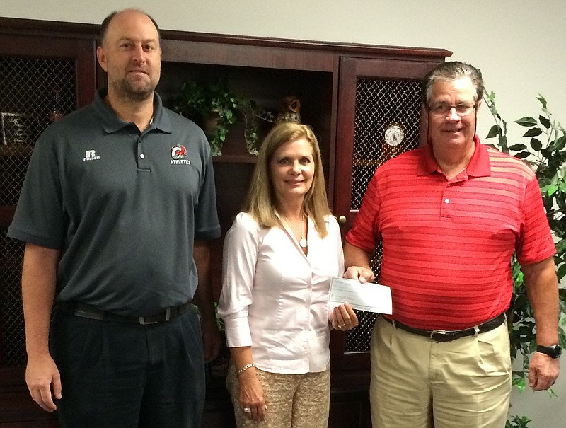 At the Ooltewah High School presentation are, from left, Jesse Nayadley, OHS athletic director; Lisa Rice, SouthEast Bank vice president; and Ooltewah High School Principal Jim Jarvis.