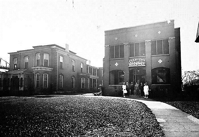 The Carver Memorial Hospital (right) is seen in this historic photo.