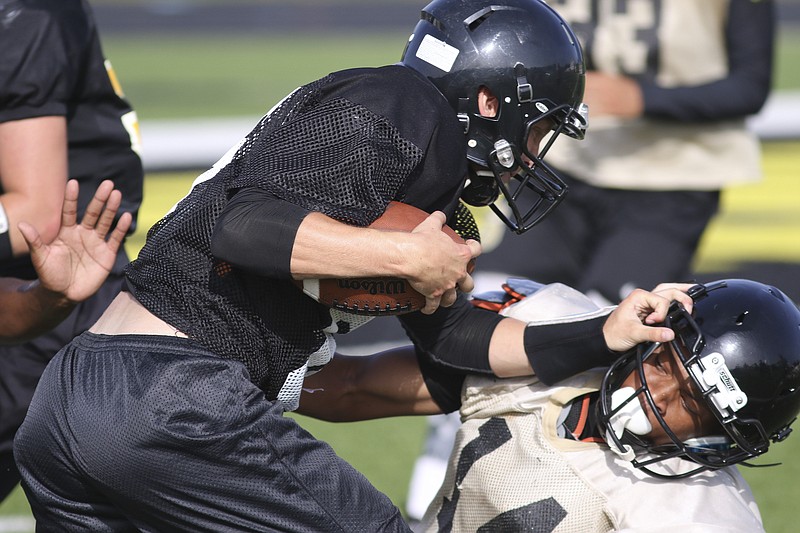 Will Swantic, shown running the ball during a summer camp at North Murray, has left the Mountaineers and will finish out his senior year at Southeast Whitfield, where he started at quarterback for two seasons.