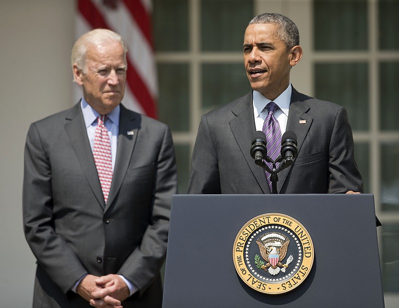 President Barack Obama, accompanied by Vice President Joe Biden, speaks in the Rose Garden of the White House in Washington in July. The vice president is expected to announce his decision about whether to pursue a presidential bid.