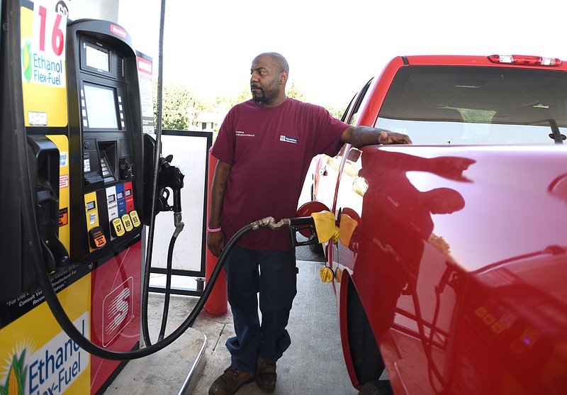 Corey Brown fills his vehicle at Speedway on Bonny Oaks Drive.