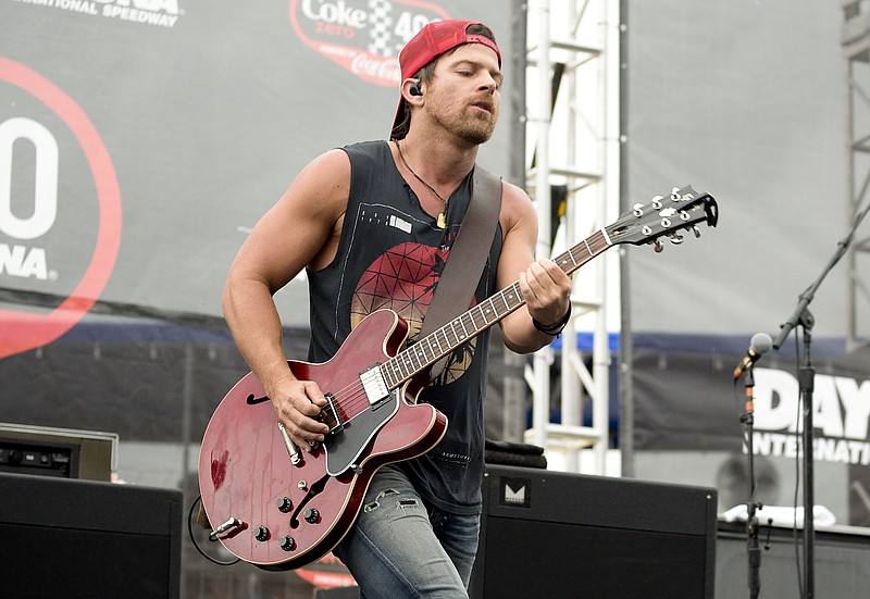 
              FILE - In this July 5, 2015 file photo, musician Kip Moore performs before the start of the NASCAR Sprint Cup series auto race in Daytona Beach, Fla. Last month in Annapolis, Maryland, Moore opened the first of four skate parks that he is helping to fund with the Comeback Kid Skatepark Project, an initiative of his donor-advised charitable fund, Kip’s Kids Fund. Another park opened in San Marcos, Texas, and two more will be opened in Nashville, Tennessee and Boston. (AP Photo/Phelan M. Ebenhack, File)
            