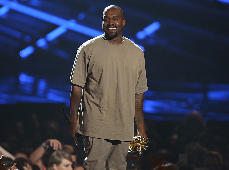 
              FILE - In this Aug. 30, 2015 file photo, Kanye West accepts the video vanguard award at the MTV Video Music Awards in Los Angeles. Sunday’s MTV Video Music Awards were peppered with commercials warning young adults about the dangers of drugs but during the show itself, drug references were almost as predominant as the music. As West accepted the Michael Jackson Video Vanguard Award, he informed the audience that, “Yes, I rolled up a little something” before taking the stage.  (Photo by Matt Sayles/Invision/AP, File)
            