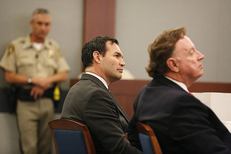 George Tiaffay, center, appears in court with his attorney Robert Langford, right, Tuesday, Aug. 25, 2015, in Las Vegas. Tiaffay is accused of hiring a homeless man to kill his wife Shauna Tiaffay nearly three years ago. 