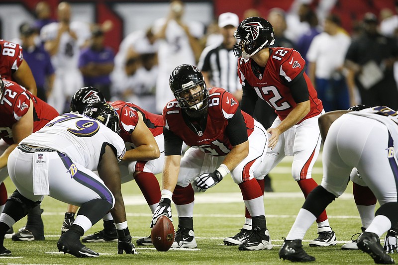 Atlanta Falcons quarterback Sean Renfree (12) works with Atlanta Falcons center Joe Hawley (61) during their preseason game against the Baltimore Ravens , Thursday, Sept. 3, 2015, in Atlanta. 