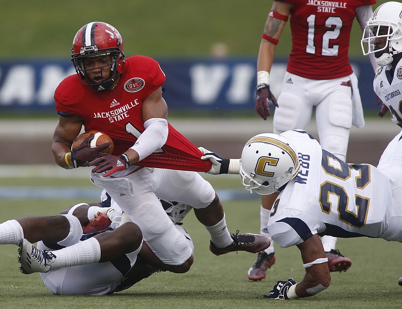 UTC defensive back Lucas Webb (29) tackles Jacksonville State cornerback Rashod Byers during the Mocs' home football game against the Gamecocks on Saturday, Sept. 6, 2014, at Finley Stadium in Chattanooga, Tenn. 