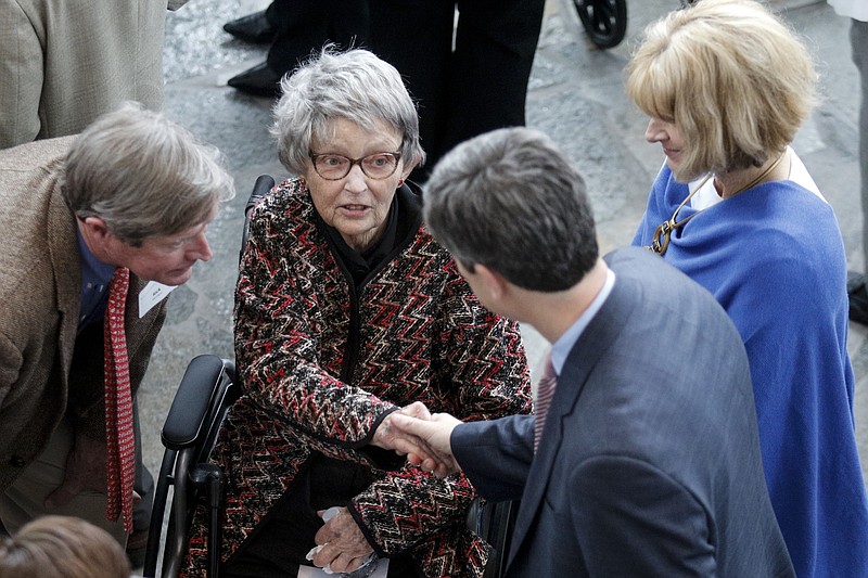 Mai Bell Hurley, center, shakes hands with Mayor Andy Berke in March before accepting ArtsBuild's Ruth Holmberg Arts Leadership Award during a ceremony at the Hunter Museum of American Art in Chattanooga. Hurley was presented with the award for her pioneering advocacy of the arts in Chattanooga.