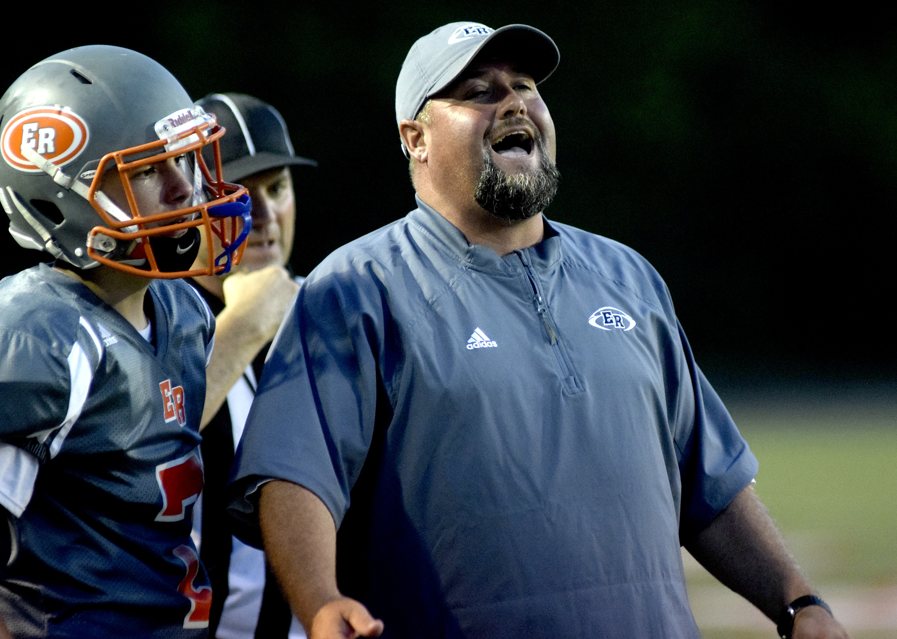 East Ridge head coach Tracy Malone shows his displeasure over a official's call.  The East Ridge Pioneers hosted the Signal Mountain Eagles at Baylor School in TSSAA football action on Friday September 4, 2015.