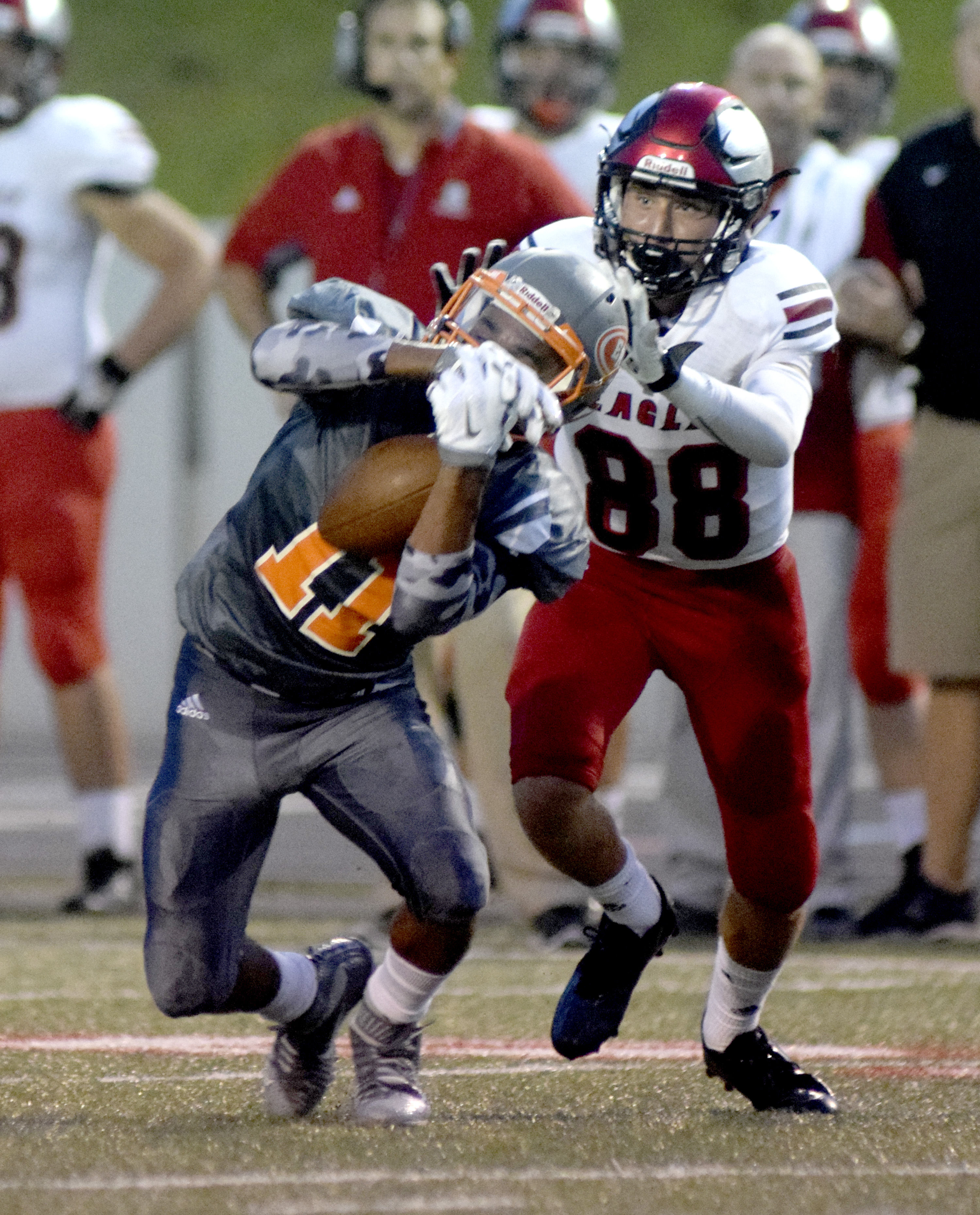 East Ridge's C.J. Bond (11) intercepts a Signal Mountain pass in front of Leyton Teal (88).  The East Ridge Pioneers hosted the Signal Mountain Eagles at Baylor School in TSSAA football action on Friday September 4, 2015.