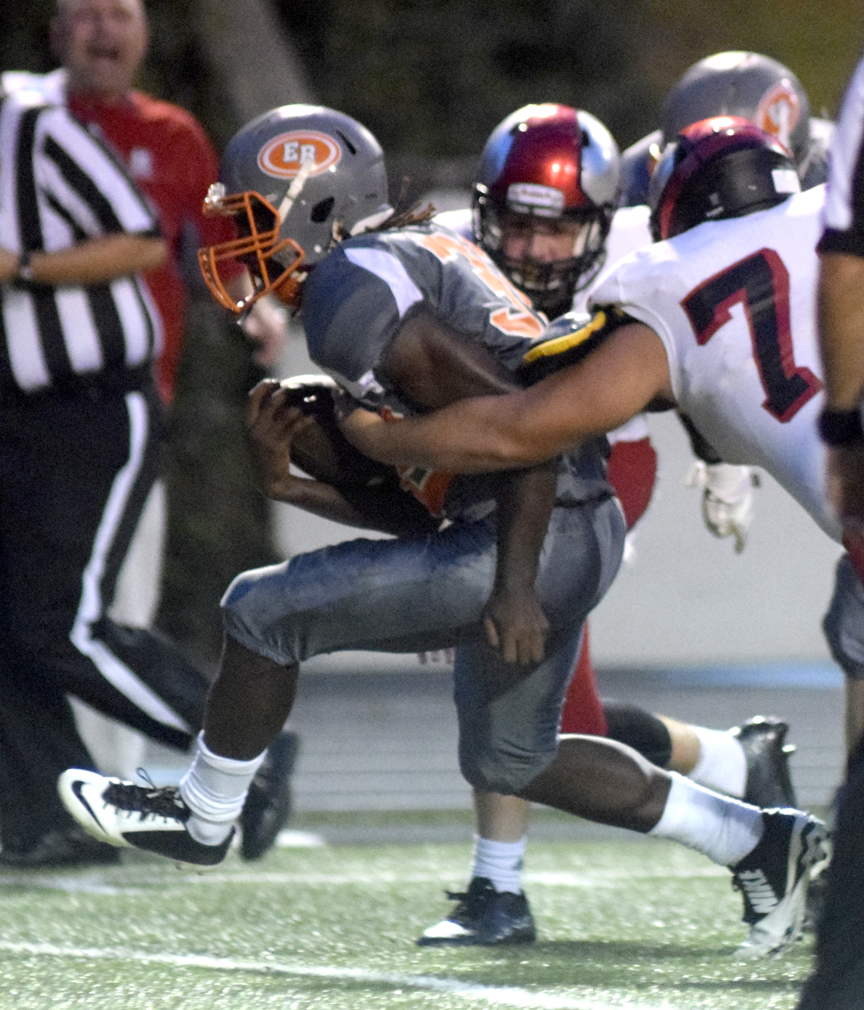 East Ridge's Traneil Moore (32) breaks several tackles to score East Ridge's first touchdown.  The East Ridge Pioneers hosted the Signal Mountain Eagles at Baylor School in TSSAA football action on Friday September 4, 2015.