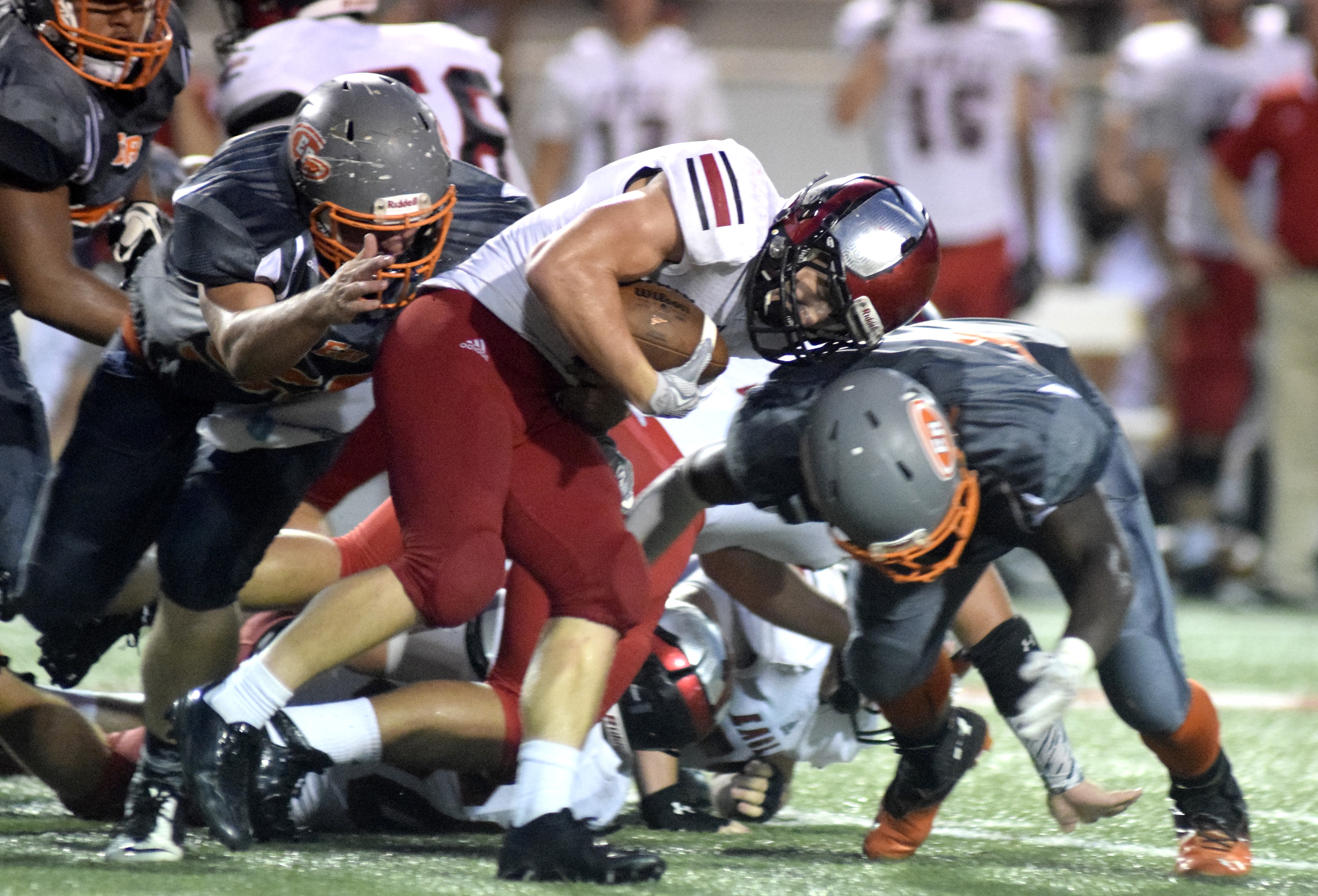 Signal Mountain's Charlie Gauthier (1) is brought down by two East Ridge defenders.  The East Ridge Pioneers hosted the Signal Mountain Eagles at Baylor School in TSSAA football action on Friday September 4, 2015.