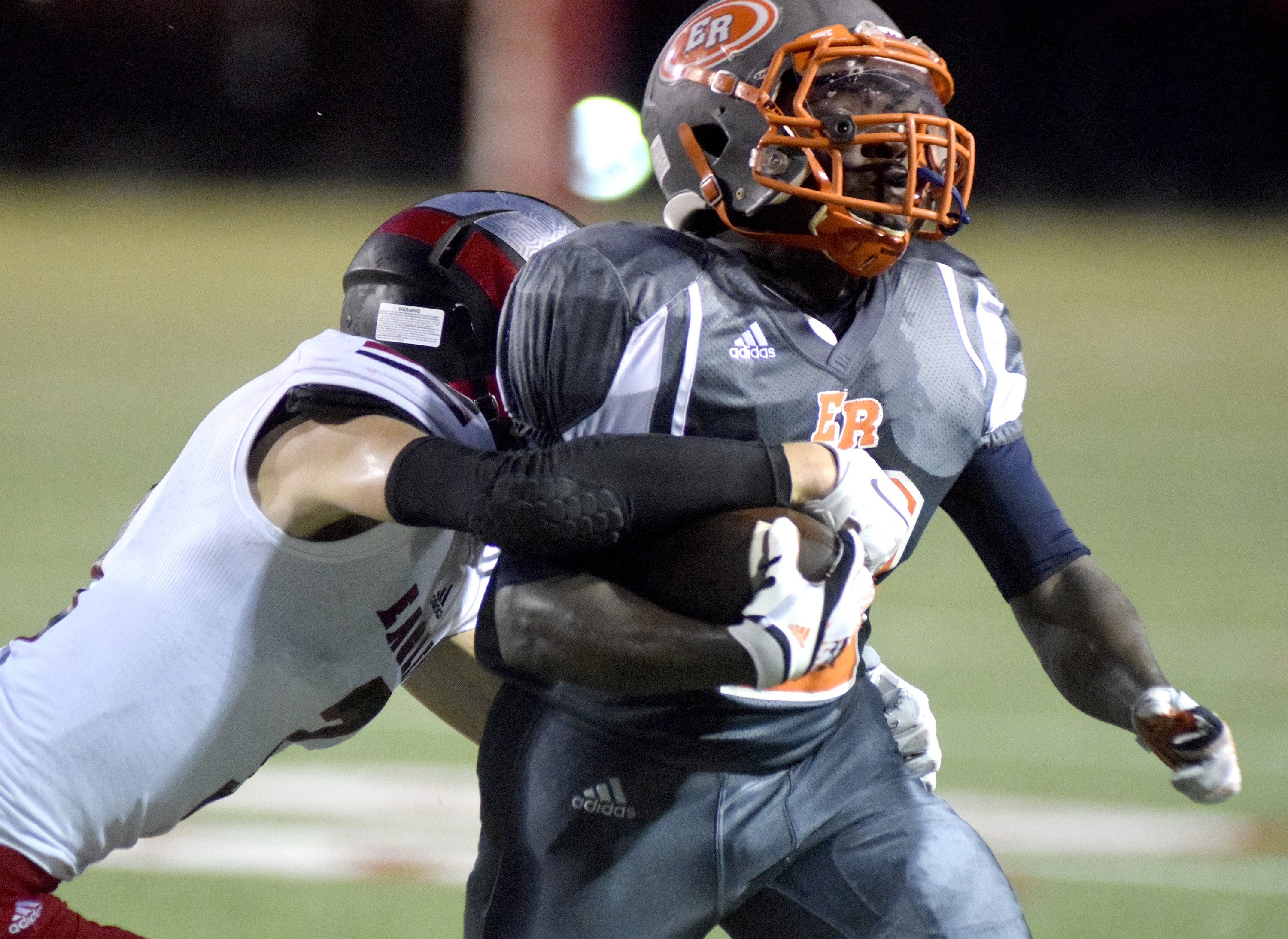 East Ridge's Dominique Millener (2) is ridden out of bounds by Signal Mountain's Drew Lowery (3).  The East Ridge Pioneers hosted the Signal Mountain Eagles at Baylor School in TSSAA football action on Friday September 4, 2015.