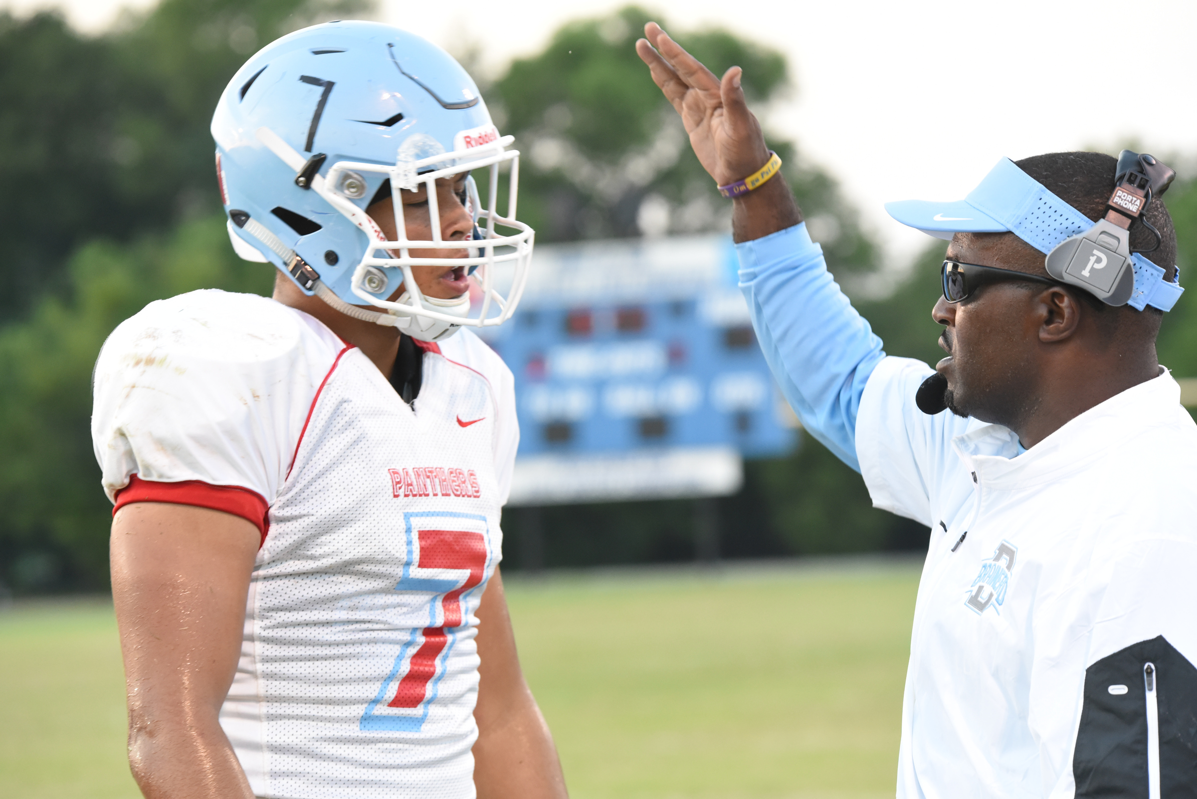 Brainerd Panthers coach Brian Gwyn, right, gives a word of encouragement to Tevin Walker early in first half action at Boyd-Buchanan.