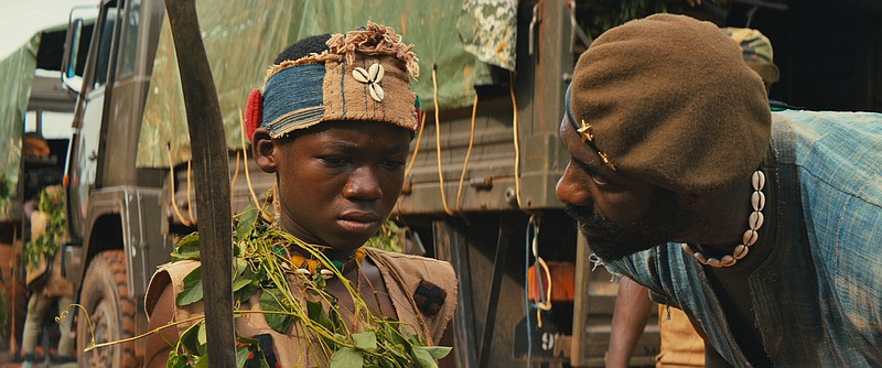 
              This photo provided by Netflix shows, Abraham Attah, left, as Agu, and Idris Elba, as Commandant, in the Netflix original film, "Beasts of No Nation," directed by Cary Fukunaga. (Netflix via AP)
            