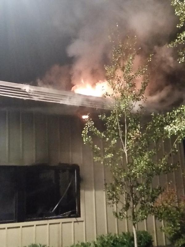 
              In this image made from a video provided by KREM.com, smoke rises as firefighter try to put out a fire at a Planned Parenthood clinic in Pullman, Wash., Friday, Sept. 4, 2015. The pre-dawn fire heavily damaged the clinic in the college town and a regional terrorism task force is working to determine whether it was arson. (KREM.com via AP) MANDATORY CREDIT
            