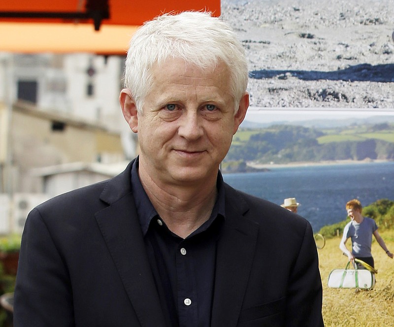 
              FILE - In this Oct. 21, 2013 file photo, British director Richard Curtis poses for the photographers as he present his latest movie "About Time" , in Rome.  The United Nations is launching a global campaign with a media blitz and an array of stars from Beyonce to Usain Bolt to spread news to everyone in the world about its new goals to eradicate poverty, fight inequality and combat climate change. Curtis, who is leading the campaign, told a news conference Thursday, Sept. 8, 2015, that he wants to make these new goals "much more famous and much more well-known" than the eight U.N. Millennium Development Goals adopted at a summit in 2000 which they will succeed. (AP Photo/Gregorio Borgia, FIle)
            