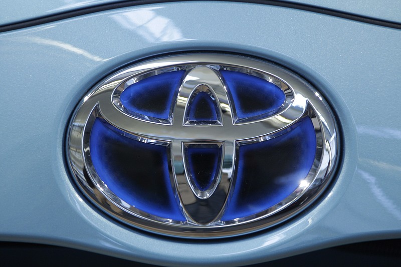 
              FILE - This Feb. 16, 2012 file photo shows a Toyota ornament on a vehicle on display at the Pittsburgh Auto Show. Toyota on Friday, Sept. 4, 2015 announced it is investing $50 million with Stanford University and the Massachusetts Institute of Technology in hopes of gaining an edge in an accelerating race to phase out human drivers. (AP Photo/Gene J. Puskar, File)
            