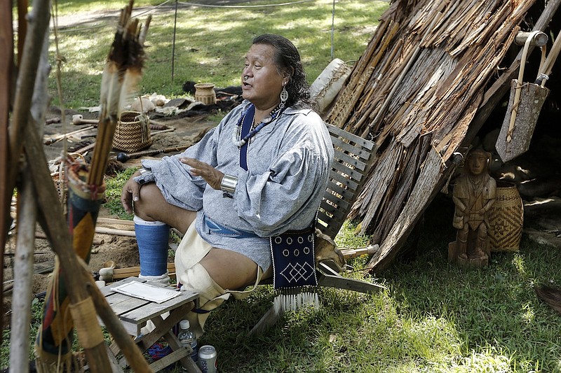 Cherokee educator Diamond answers questions about cultural artifacts at the Cherokee Heritage Festival at Red Clay State Park on Saturday, Aug. 29, 2015, in Cleveland, Tenn. The festival marks the first time since 1838 that the three federally recognized Cherokee tribes have met at the park.