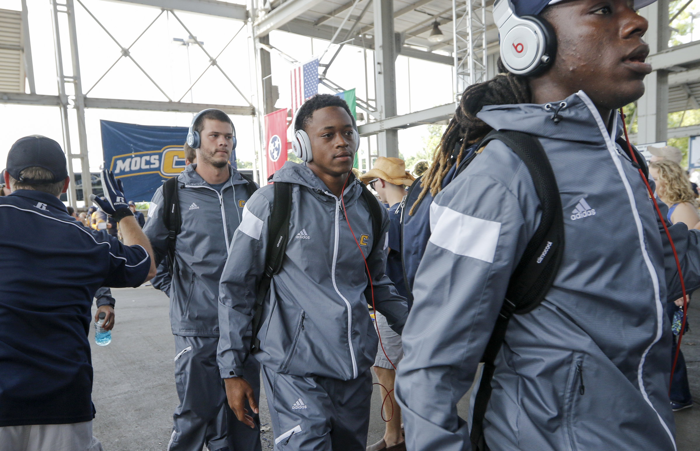 The UTC football team enters the First Tennessee Pavilion before the Mocs' season-opener football game against Jacksonville State at Finley Stadium on Saturday, Sept. 5, 2015, in Chattanooga, Tenn.