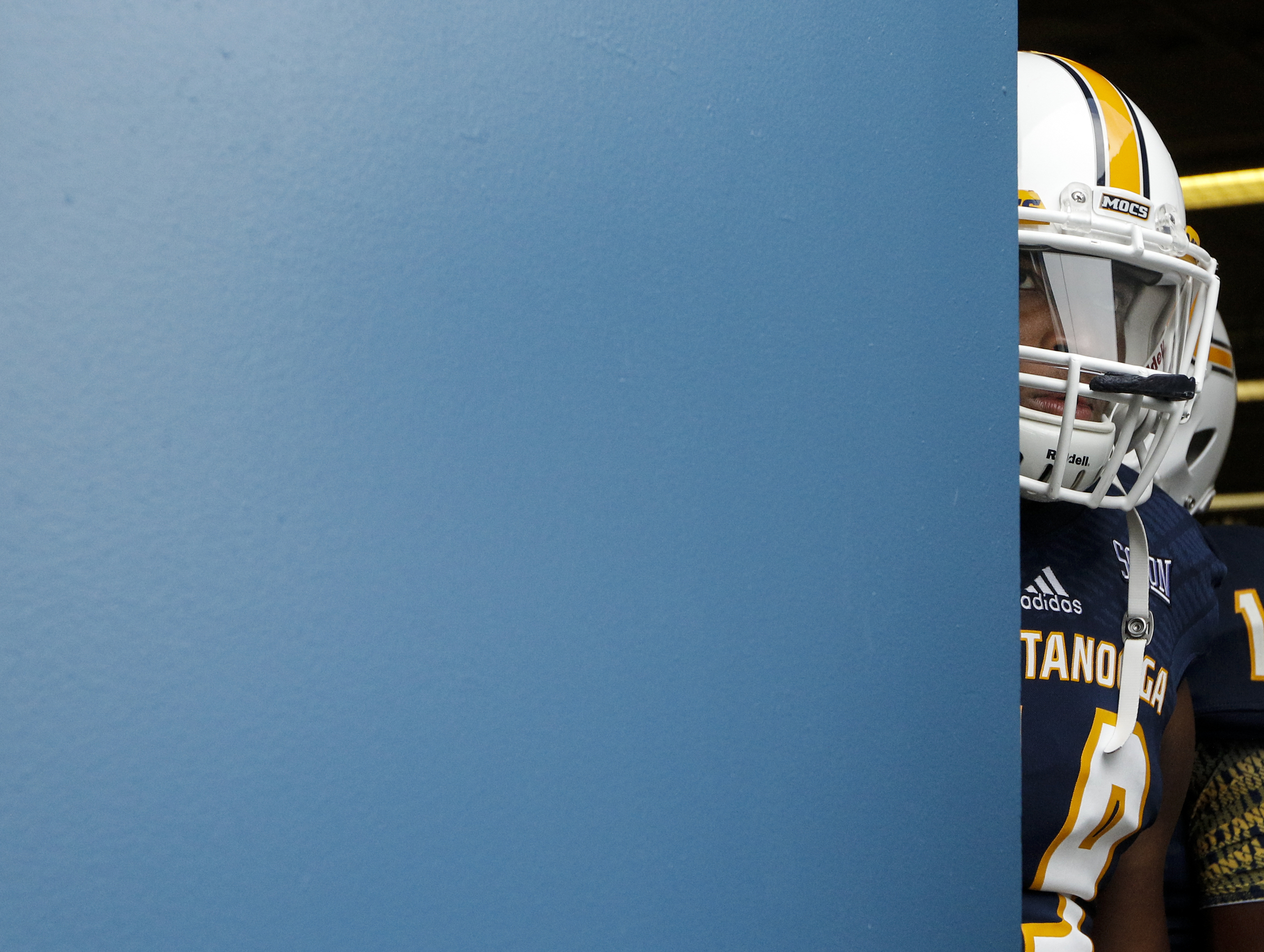 UTC's Cole Brown peeks from the locker room before taking the field for warmups before the Mocs' season-opener football game against Jacksonville State at Finley Stadium on Saturday, Sept. 5, 2015, in Chattanooga, Tenn.