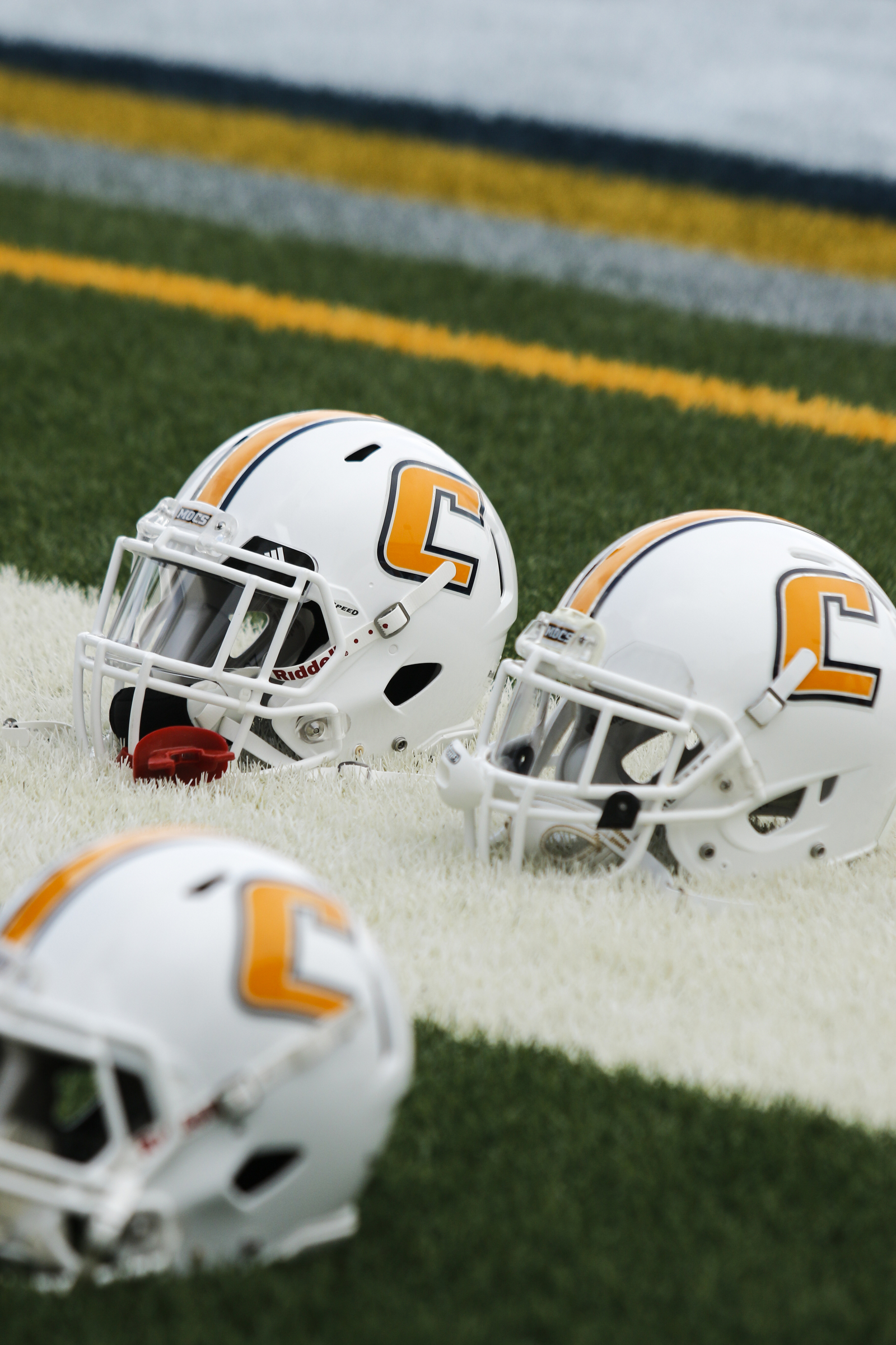 UTC helmets are laid out as the team warms up before the Mocs' season-opener football game against Jacksonville State at Finley Stadium on Saturday, Sept. 5, 2015, in Chattanooga, Tenn.