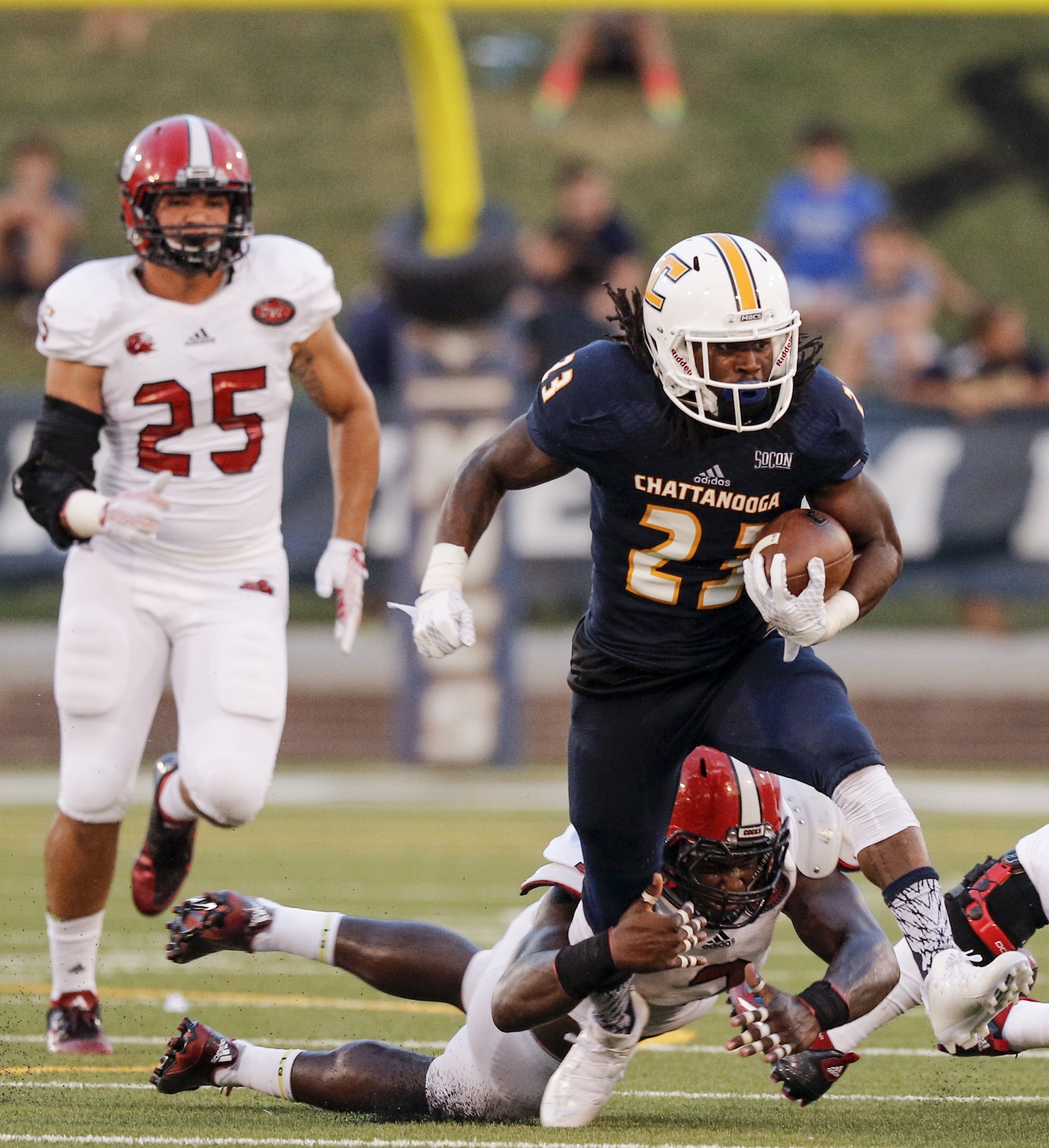 UTC running back Richardre Bagley (23) tries to shake Jacksonville State linebacker Joel McCandless during the Mocs' season-opener football game against Jacksonville State at Finley Stadium on Saturday, Sept. 5, 2015, in Chattanooga, Tenn.
