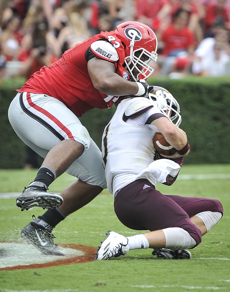 Georgia defensive lineman Chris Mayes (93) brings down Louisiana Monroe quarterback Garrett Smith (13) during their game, Saturday, Sept., 5, 2015, in Athens, Ga. 