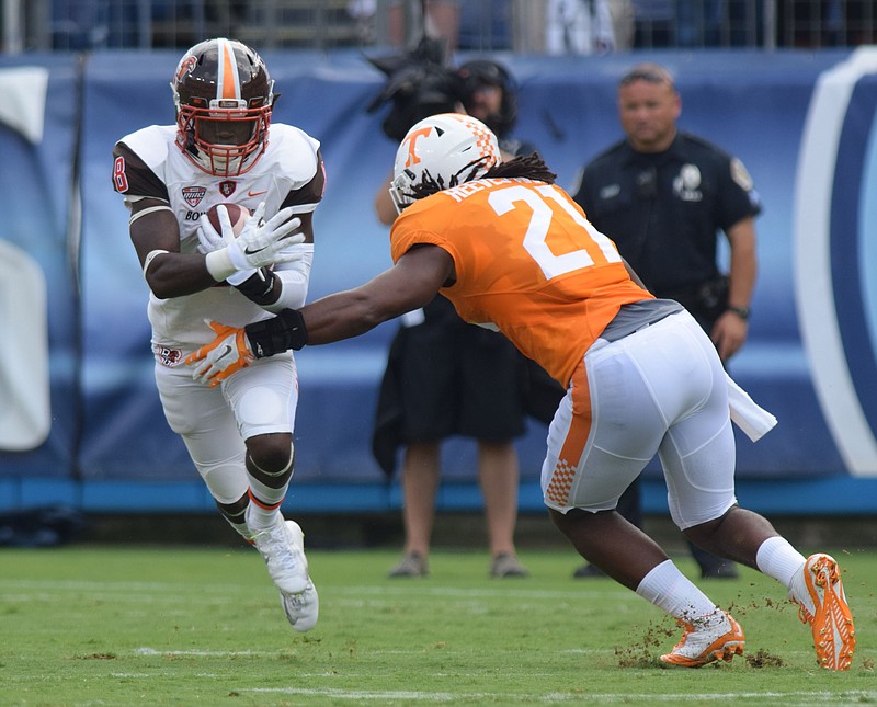 Bowling Green's Travis Greene (8) tries to get around Tennessee's Jalen Reeves-Maybin (21).  The Tennessee Volunteers hosted the Bowling Green Falcons at Nissan Stadium in Nashville September 5, 2015.